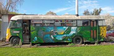 The image shows a colorful, multi-story building with a large, open area and a smaller, enclosed area, featuring a prominent tower and a large, open space. The building appears to be a public structure.